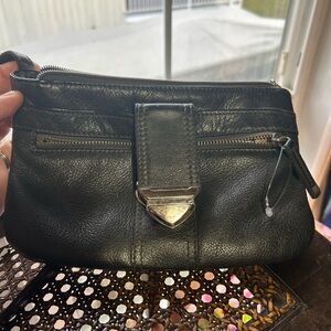 A grey pebbled leather Danier clutch or crossbody bag with metal clasp.- used
